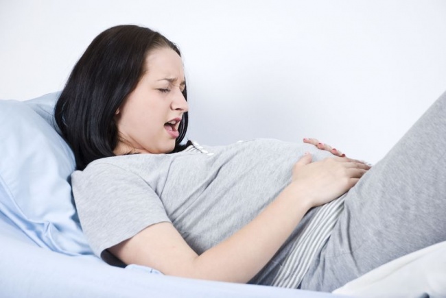почему болит живот при беременности 3 триместр